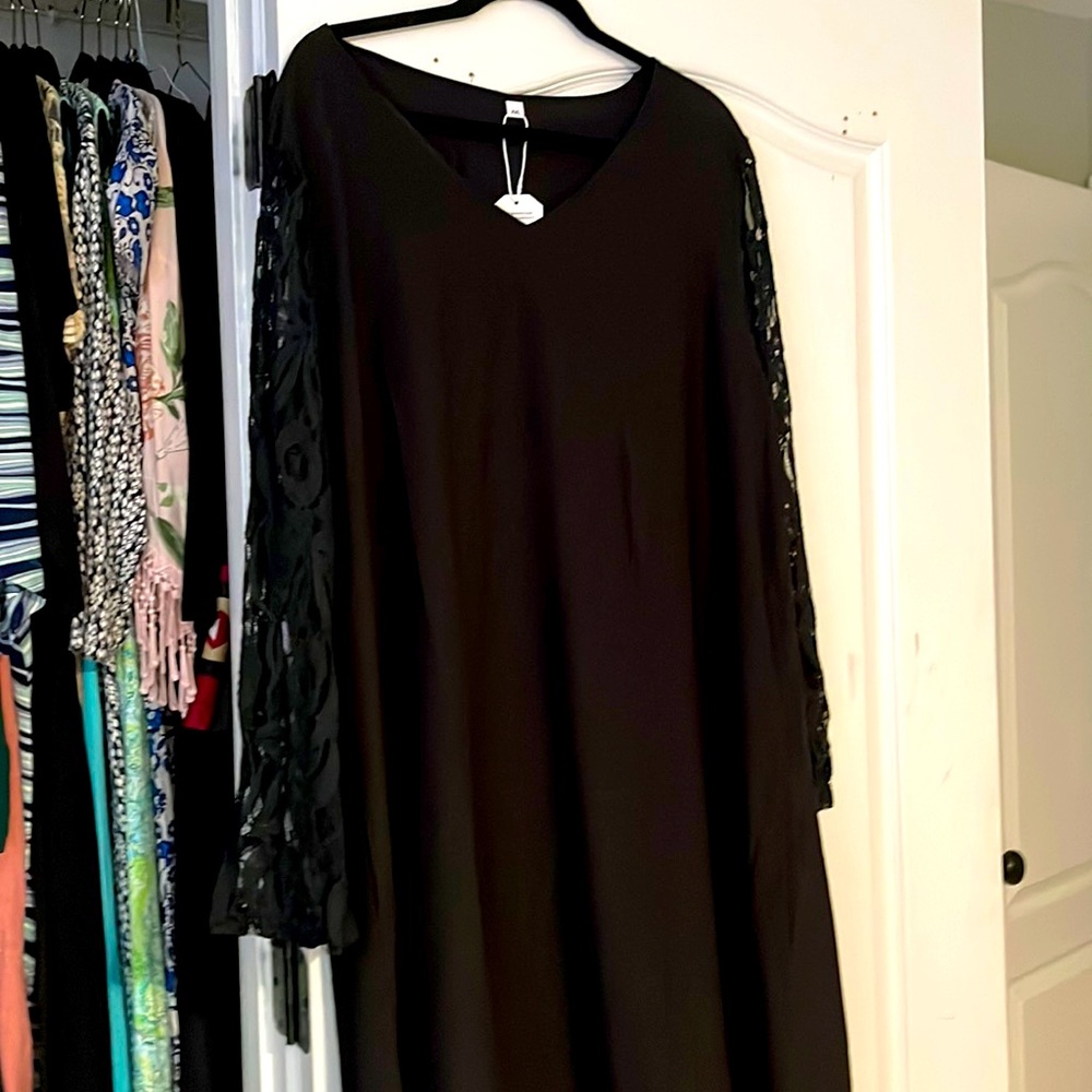 Brand new black cocktail dress with lace sleeves